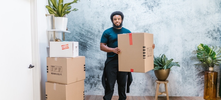 A mover holding a box