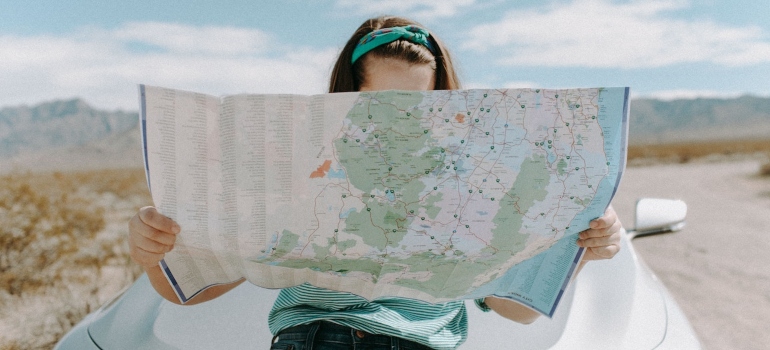 A woman looking at the map