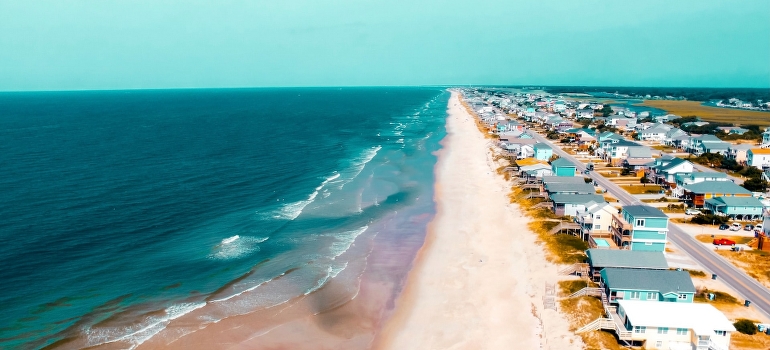 aerial view of homes by the beach 