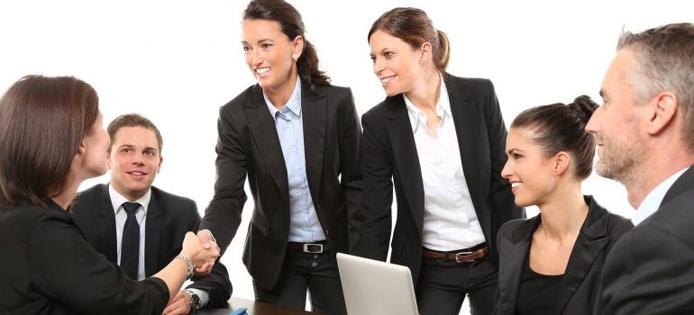 Business owners in a meeting talking about the places to move in Texas in 2023