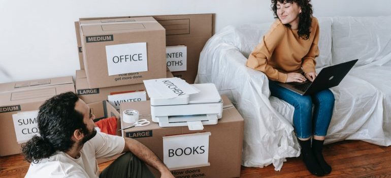 A couple packing their things for the move