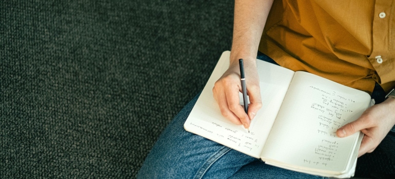 a girl writing down a plan