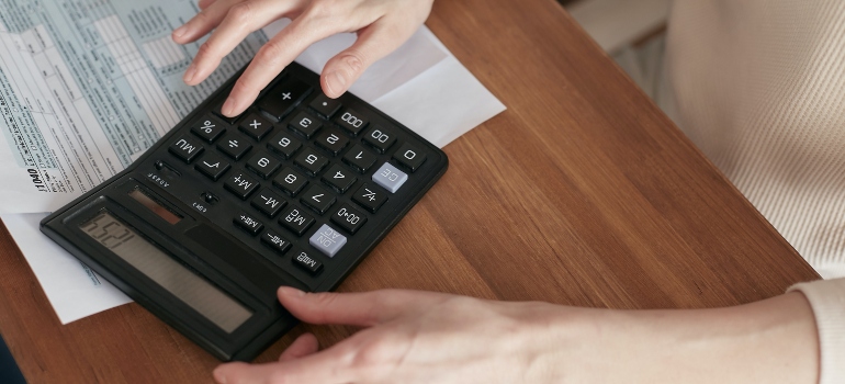 Person calculating what is the most affordable city in the US in 2023