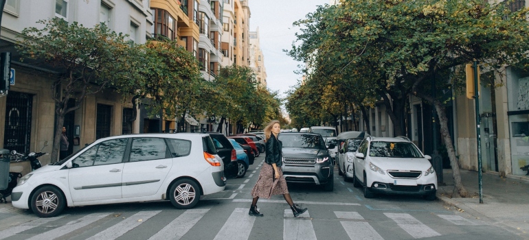 image of a woman crossing the street