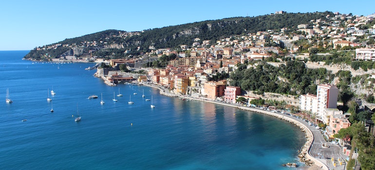 aerial view of the city next to the body of water 