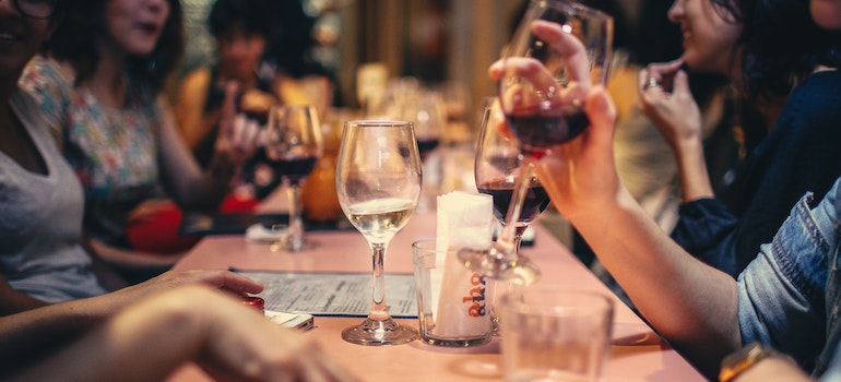 A group of friends spending time together and drinking to something, possibly in one of the Florida cities.