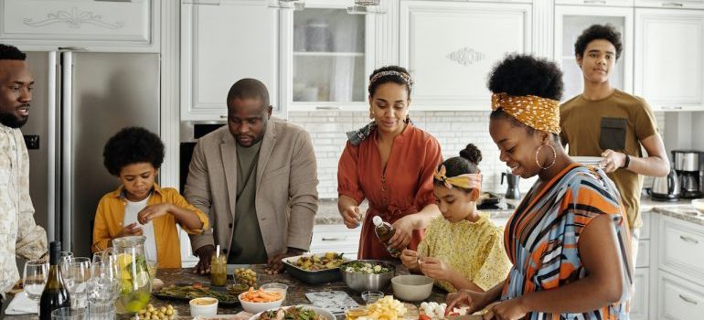 family making dinner and celebrating after moving from Bellaire TX to Asheville NC