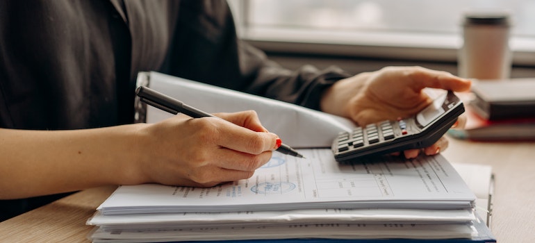 Woman calculating and wondering why Texas has been among the most moved-to states