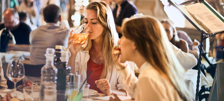 Woman Drinking Wine after moving to Cedar Park.