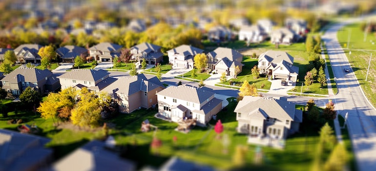 A suburban neighborhood viewed from a birds-eye perspective. 