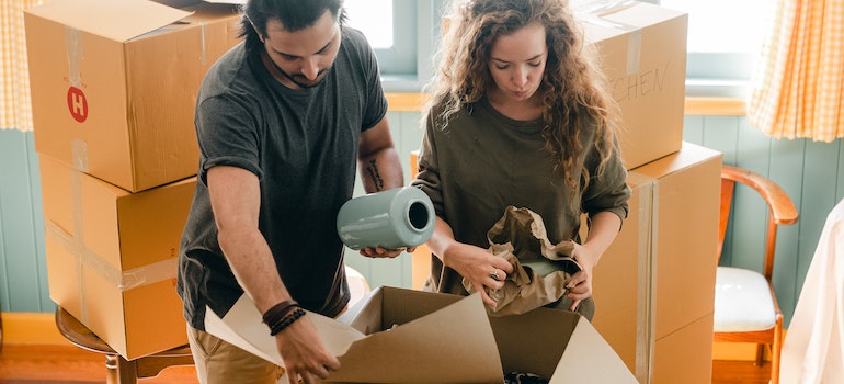 Couple packing their things for a move