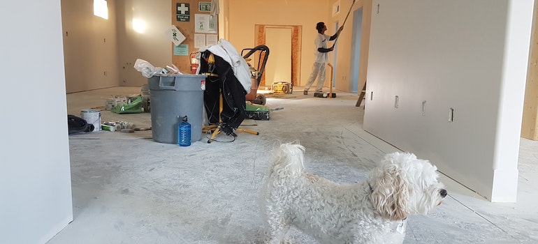 picture of man painting your house as part of Selling Your Texas Home process