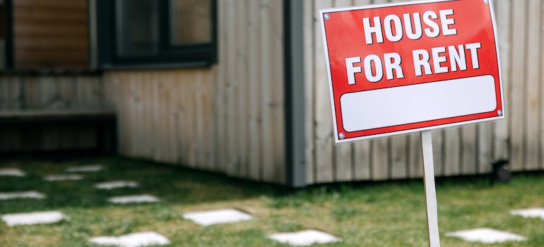 House for rent red sign on from of the house