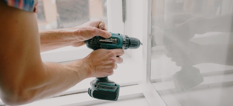 MAn doing some house maintenance