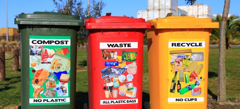green, red, and yellow trash bins for sorting garbage