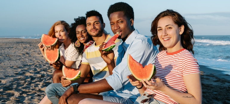 a group of friends on a beach