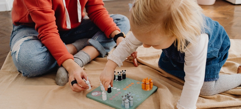 kids playing a board game is one of many family fun ideas in Schertz