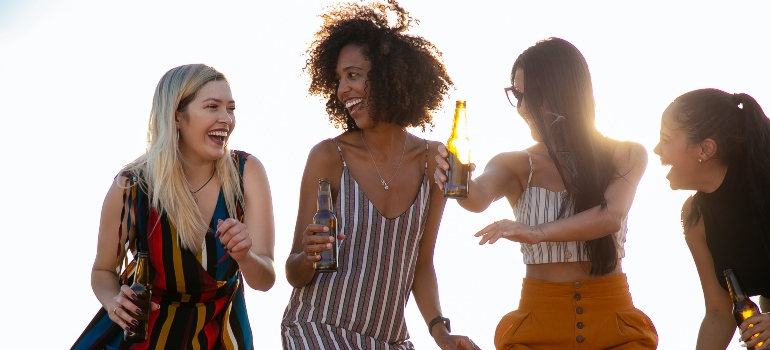 a group of friends celebrating after successfully adapting to a new culture and language after leaving Texas