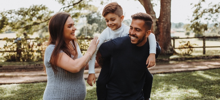 a family of three in a park