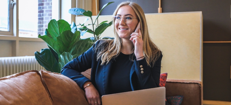 a woman talking on the phone about the top Austin suburbs for commuters