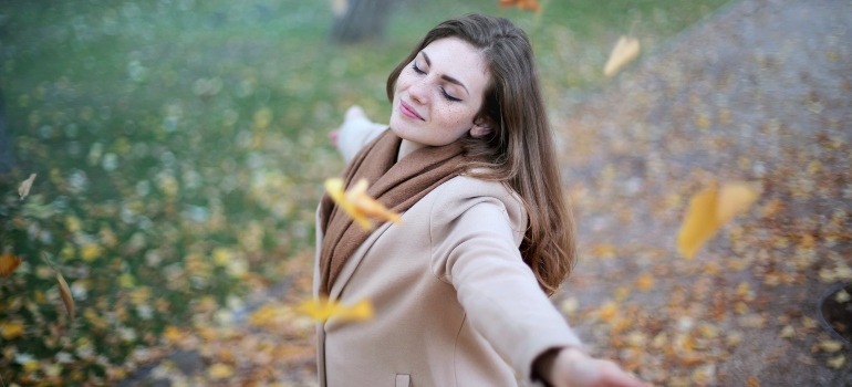 a woman dancing in a park