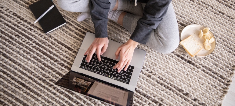 a man typing something on a computer