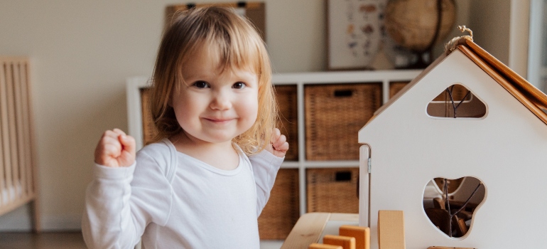 a child playing with wooden toys